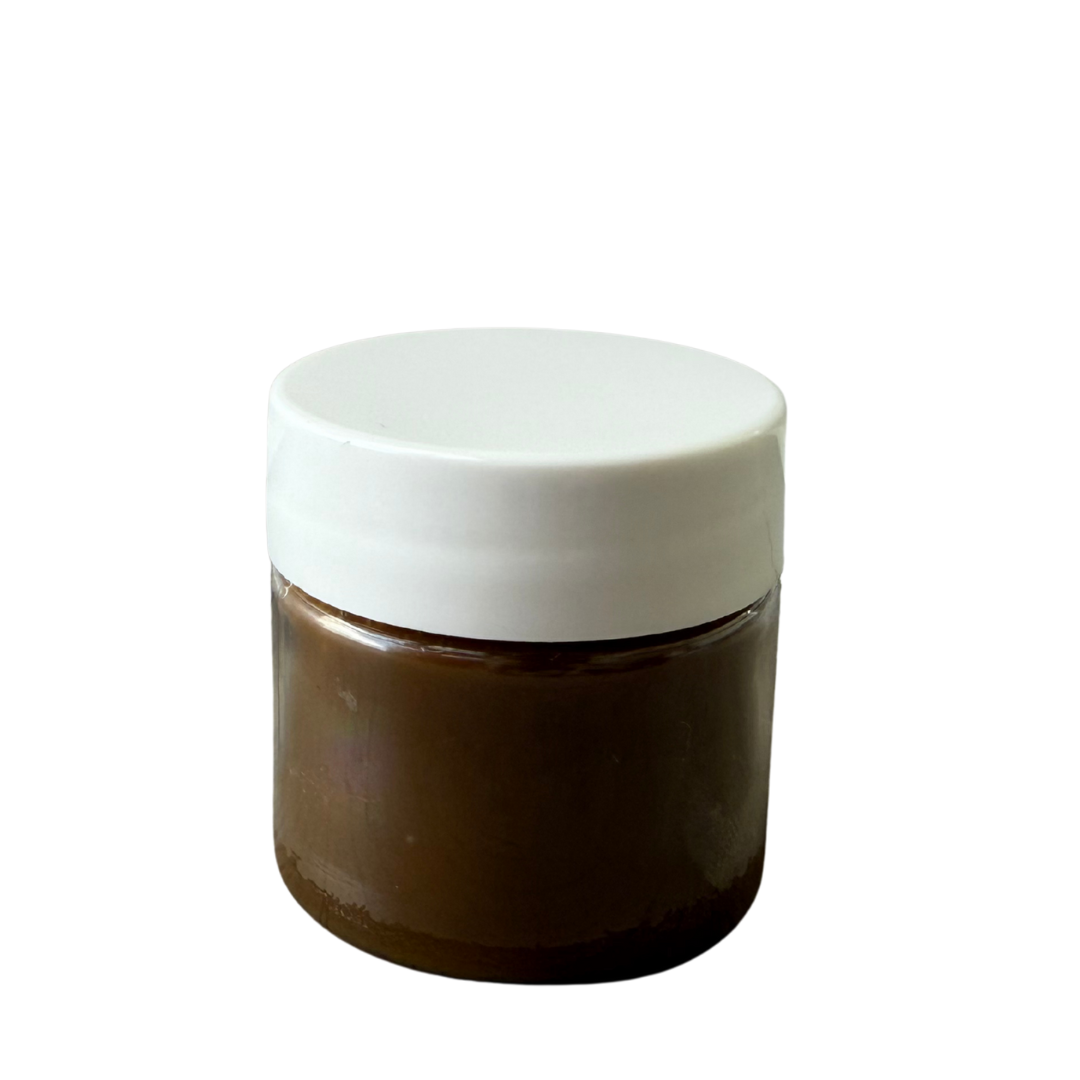 Image of Bare Skin. Cosmetics 0.5oz Raw Batana Oil against a White Background.
